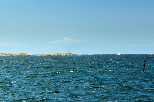 Blowing on the swedish west coast on a blue sky