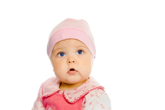 Cute baby girl in a pink dress and hat. Portrait. Studio. Isolated.