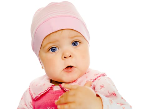 Cute baby girl in a pink dress and hat. Portrait. Studio. Isolated.