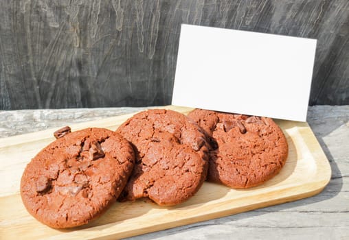 Homemade chocolate cookies with blank name card, stock photo