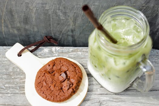 Iced green tea latte and chocolate cookies, stock photo