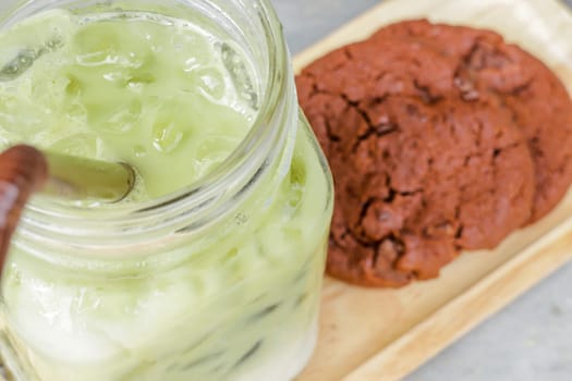 Iced green tea latte and chocolate cookies, stock photo