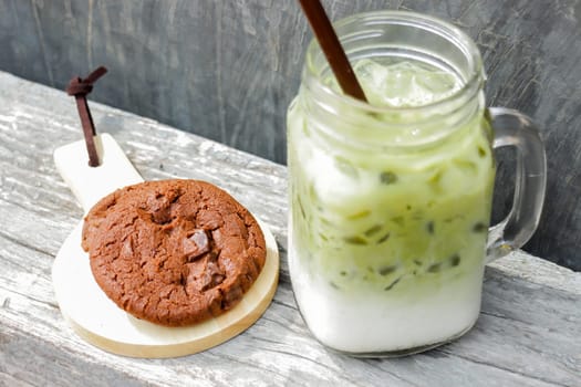 Iced green tea latte and chocolate cookies, stock photo