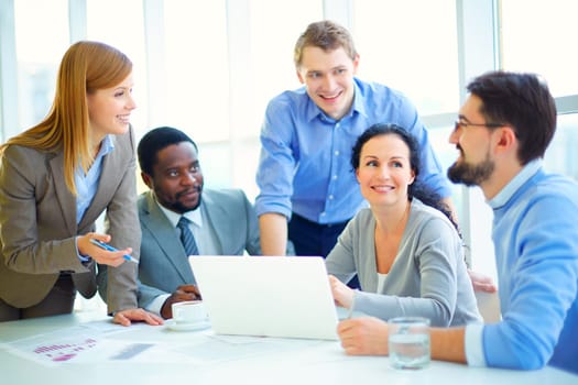 Young managers discussing plans at meeting