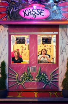 MUNICH, GERMANY – Oct. 2, 2015: Two Ladies Selling Tickets for an Event at the Annual Oktoberfest. The Festival runs from September 19th until October 4th 2015 in Munich, Germany