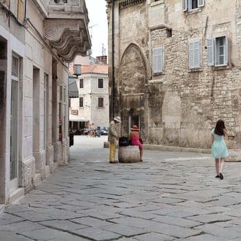 Tourists in the old town of Pula in Croatia