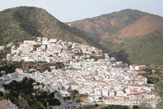 Aerial view of Ojen, white village over a hillside near Marbella, Spain. HDR