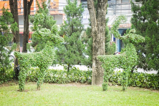 Couple deer shaped decorative green park, stock photo