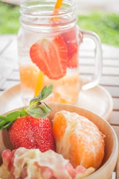 Infused water mug of mix fruit refreshing drink, stock photo