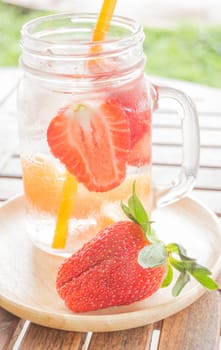 Infused water mug of mix fruit refreshing drink, stock photo