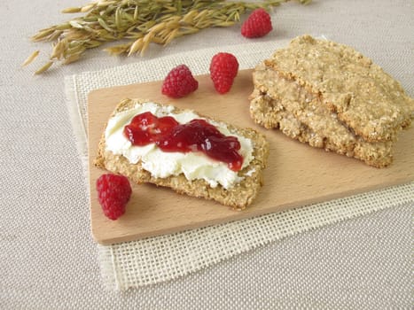 Homemade oats crispbread with raspberry jam