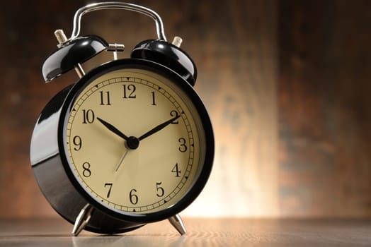 Composition with old black alarm clock.
