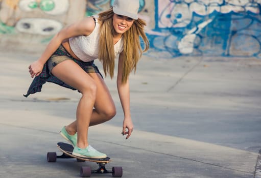 Young woman riding a skateboard