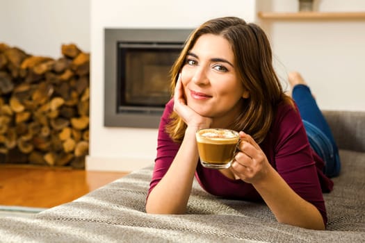 Beautiful woman at home Having a good time with cup a coffee