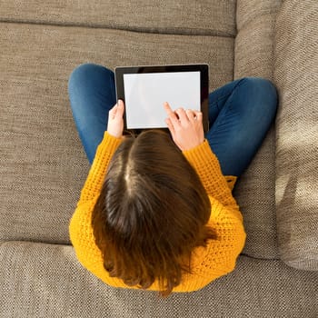 Shot of a gorgeous young woman using a digital tablet indoors, with copy space