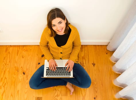 Shot of a gorgeous young woman using a digital tablet indoors, with copy space