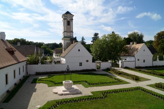 Camaldulian Hermitage inner park with ruined church, and cell buildings houses. Oroszlany - Majkpuszta, Hungary.