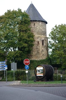 Mainz,Germany – September 19,2015: The historic tower on the Kupferberg Terraces with a wine barrel in front of its entrance on September 19,2015 in Mainz.