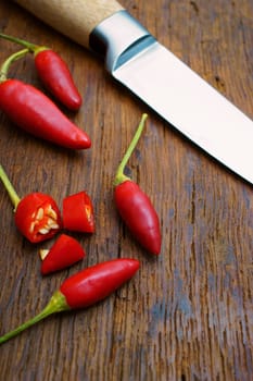 Chili peppers whole and cut with knife