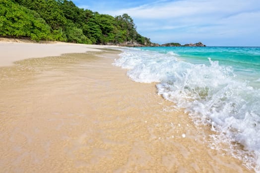 Beautiful landscape blue sea white sand and waves on the beach during summer at Koh Miang island in Mu Ko Similan National Park, Phang Nga province, Thailand