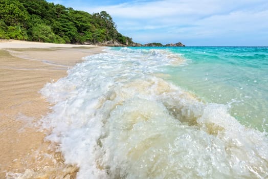 Beautiful landscape blue sea white sand and waves on the beach during summer at Koh Miang island in Mu Ko Similan National Park, Phang Nga province, Thailand