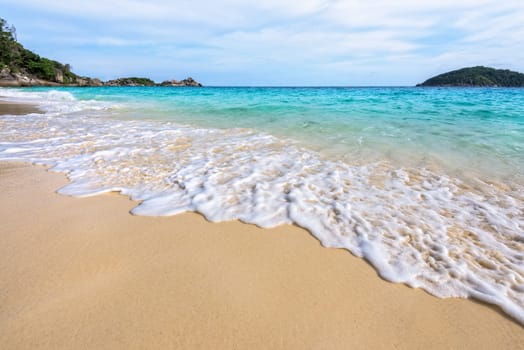 Beautiful landscape blue sea white sand and waves on the beach during summer at Koh Miang island in Mu Ko Similan National Park, Phang Nga province, Thailand
