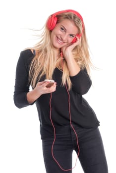 Young woman listens to music through headphones and smiles