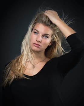 Young blonde woman with erotic charisma