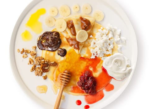 Crepes on a dish with various toppings