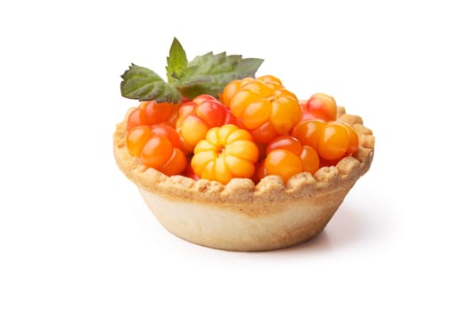 Cloudberry tart decorted with mint leaves. Sweet baked dessert with fresh wild cloudberries. Shallow depth of field