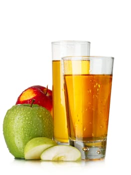 Fresh apple juices in highball glasses with red and green apples