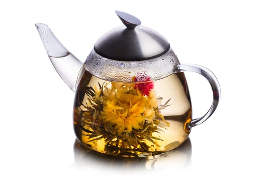 Teacup full of herbal tea with blossoming flower. Healthy eating. Sun tea