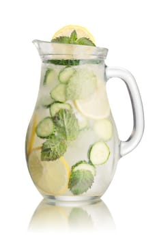Sparkling cucumber lemonade in a glass pitcher. Refreshing summer soda with lemon, mint and cucumber