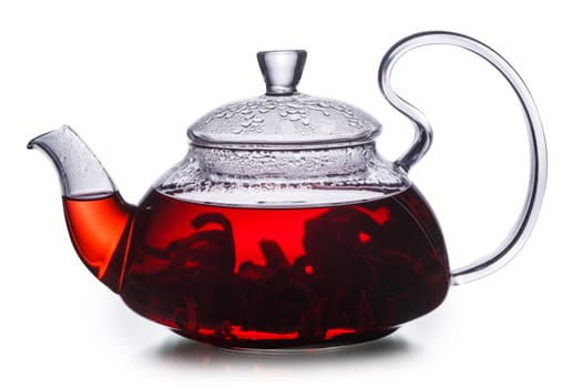 Hibiscus tea in transparent teapot. Worldwide popular healthy tea known as rosella, karkade or red sorrel.