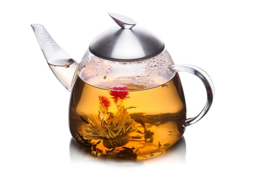 Teacup full of herbal tea with blossoming flower. Healthy eating. Sun tea