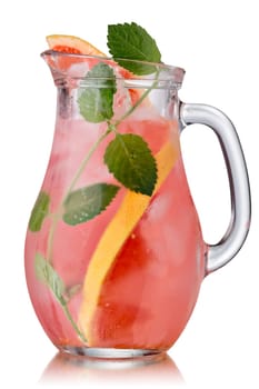 Grapefruit mint detox water in a glass jug. Pitcher of grapefruit infused water