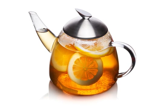 Teapot full of lemon tea. Sun tea.Healthy eating concept.