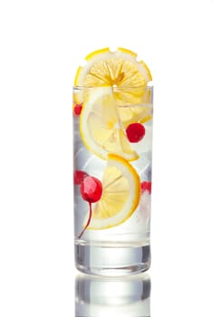 John Collins alcoholic cocktail in highball glass decorated with lemon slice. IBA official cocktail