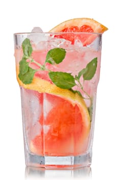Grapefruit mojito cocktail in faceted highball. Refreshing summer drink with rum,grapefruit and fresh mint