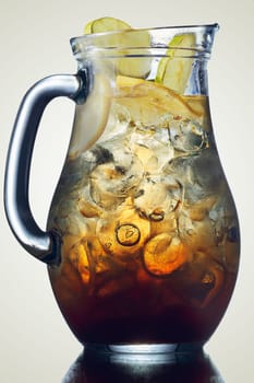 Iced tea in the pitcher. A jug of cold tea. Low key image