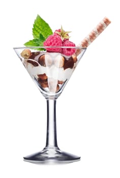 Dessert with nuts and chocolate decorated with raspberries and mint leaves. Sweet food. Parfait