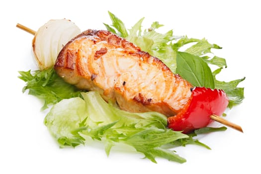Grilled kebab from salmon with vegetable garnish