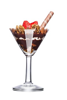 Dessert with nuts and chocolate decorated with strawberry. Sweet food. Parfait
