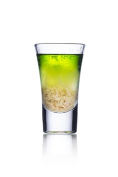 Colorful alcoholic cocktail in a shot glass