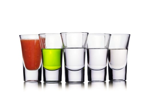 Set of alcoholic cocktail in a shot glasses