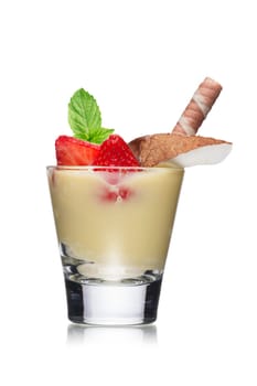 Dessert with chocolate decorated with strawberry, coconut slice and mint leaves. Sweet food. Parfait