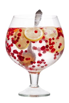 Cranberry lemon detox water in a glass jar. Healthy water with infused cranberry, cowberry and lemon