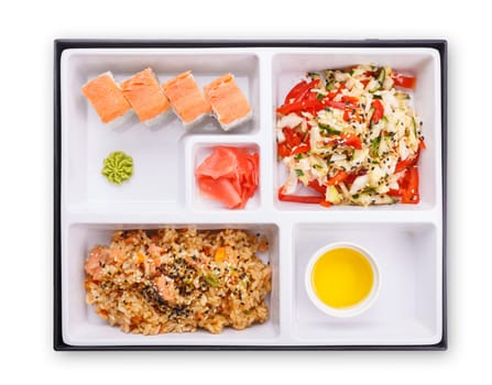 Japanese lunch box. Top view of sectioned plastic box with Japanese food.