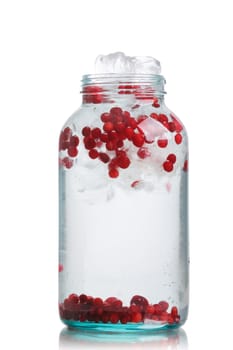 Cranberry  detox water in a glass jar. Healthy iced water with infused cranberry, cowberry and lemon