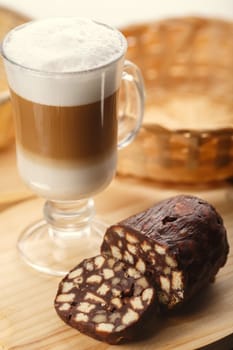Glass of latte with chocolate dessert. Sweet food. Selective focus